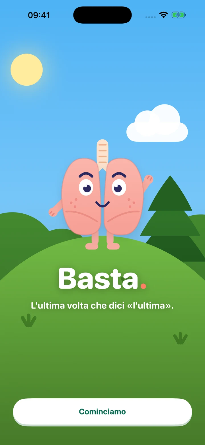 La mascotte di Basta, due polmoni rosa sorridenti in un prato al sole. Il messaggio di benvenuto dice: L’ultima volta che dici «l’ultima».